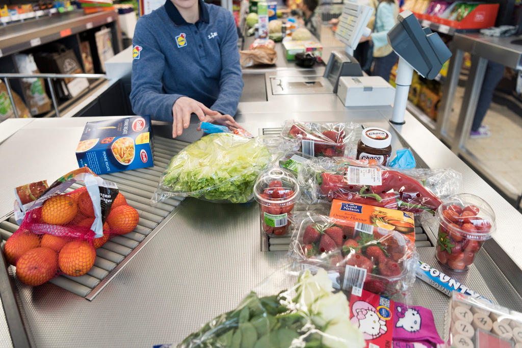 Shoppers at the checkout counter