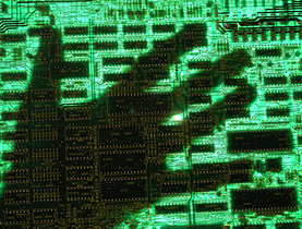 Person s hand over a computer screen