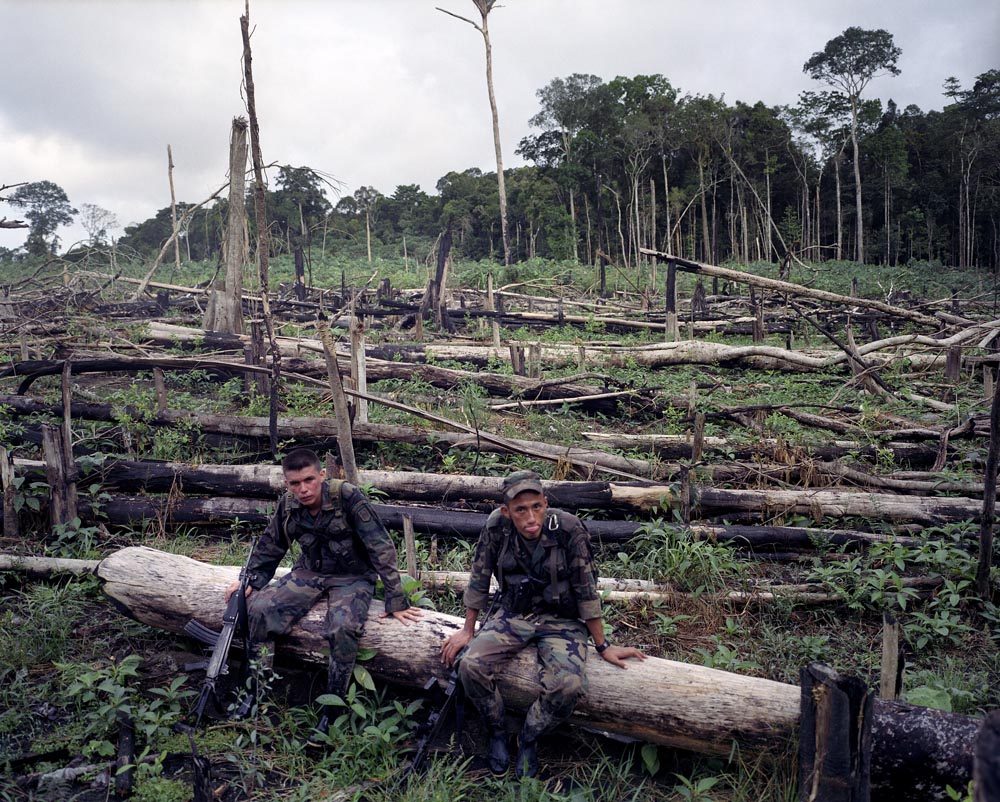 Colombian soldiers take a break in a forest clearing that has been planted with coca in the Putumayo region in southern Colombia.