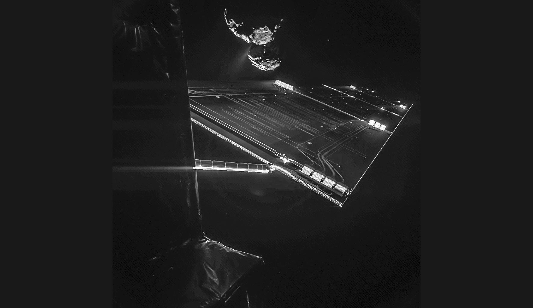 one of Rosetta s solar panels, with the comet in the background.