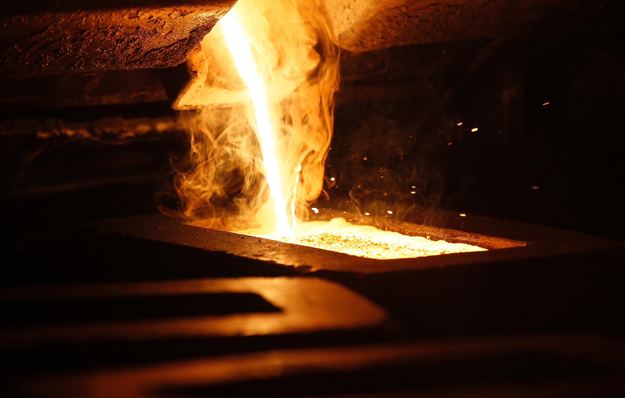 Liquid gold is poured to form gold dore bars