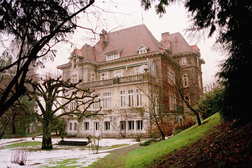 Château du Signal, David Bowie's former mansion in Lausanne, Switzerland, overlooking Lake Geneva in winter.
