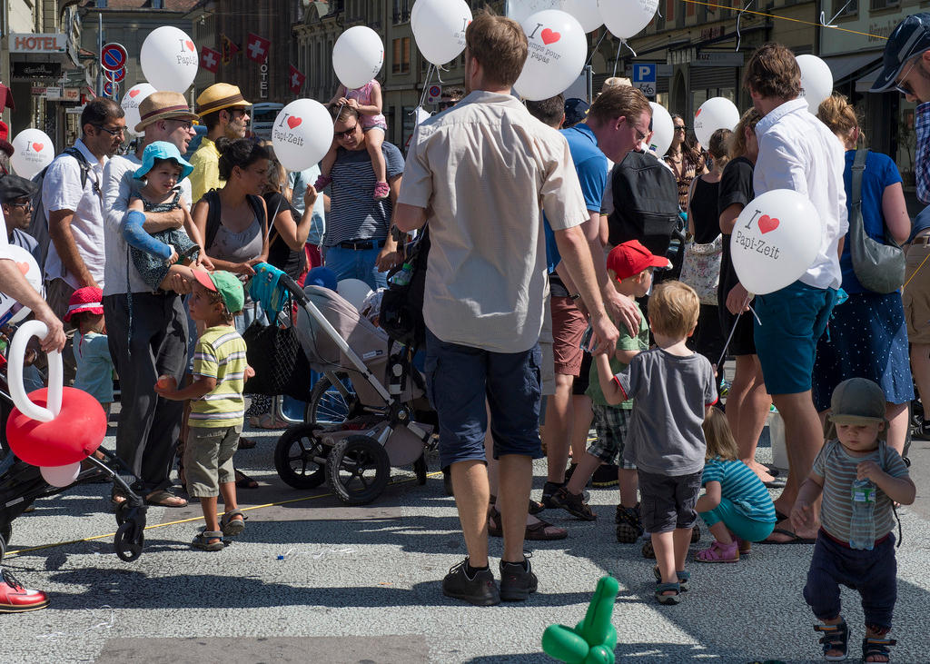 Group gathered before Bern s parliament building to call for paternity leave