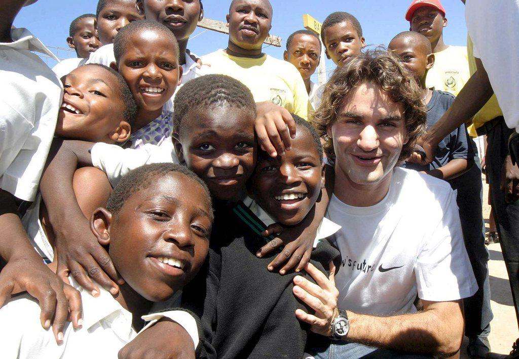 Federer with young African children