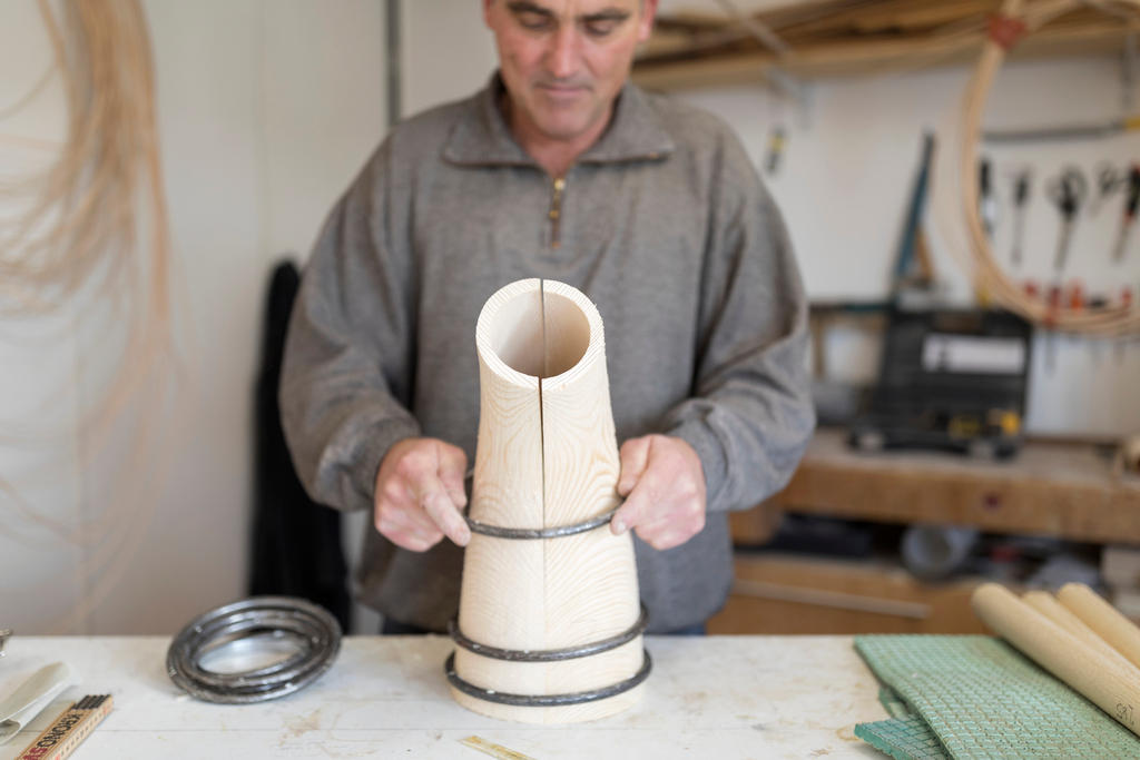 Thomas Eichenberger works on an Alphorn at his carpentry workshop in the canton of Lucerne.