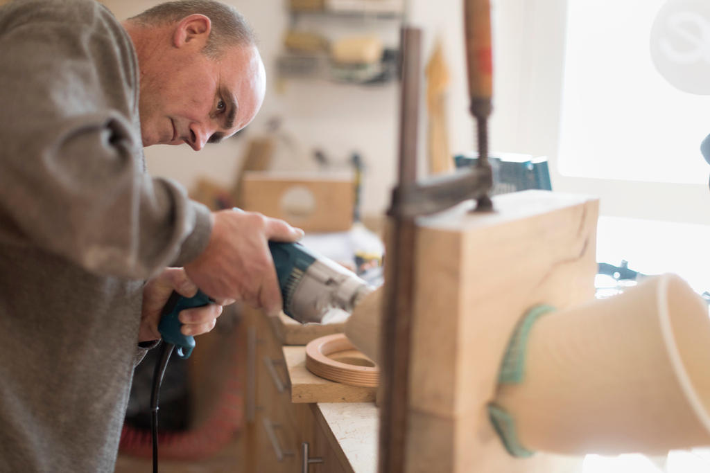 Thomas Eichenberger works on an Alphorn at his carpentry workshop in the canton of Lucerne.