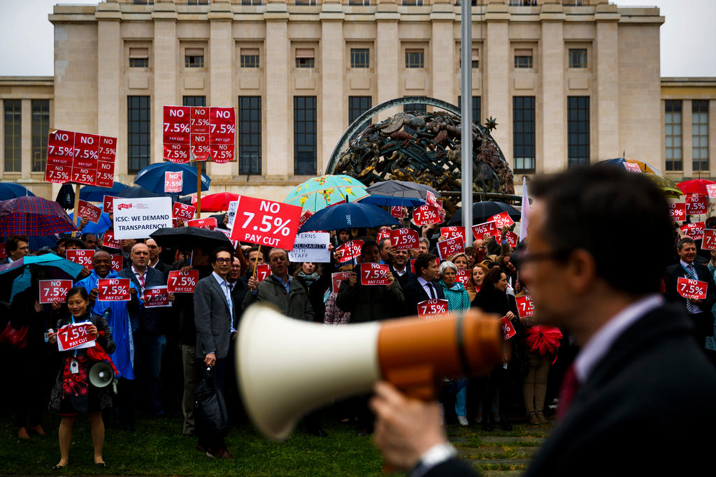 UN staff protest against pay cuts plans in Geneva.