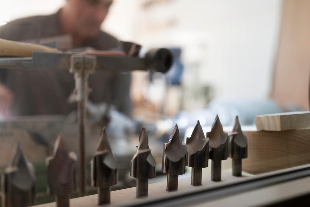 Thomas Eichenberger works on an Alphorn at his carpentry workshop in the canton of Lucerne.