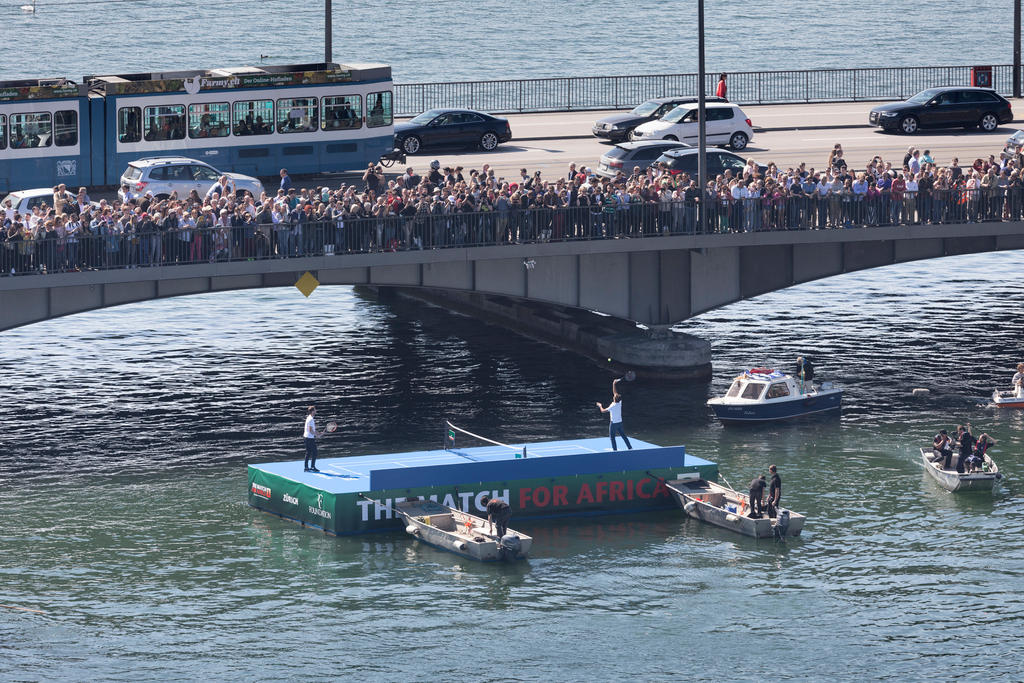 Swiss tennis player Federer plays tennis with Andy Murray of Great Britain, on a float in Zurich