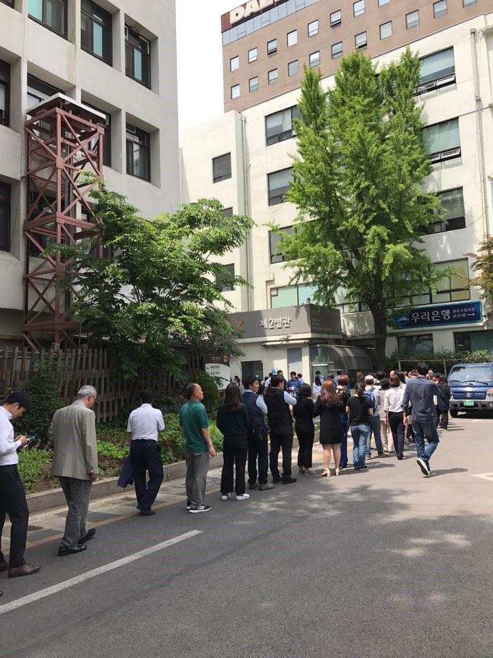 Queue of people outside polling station