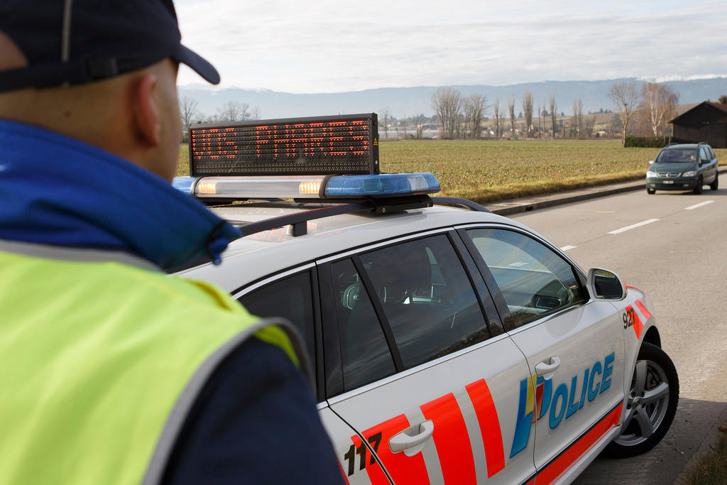 traffic policeman beside his car