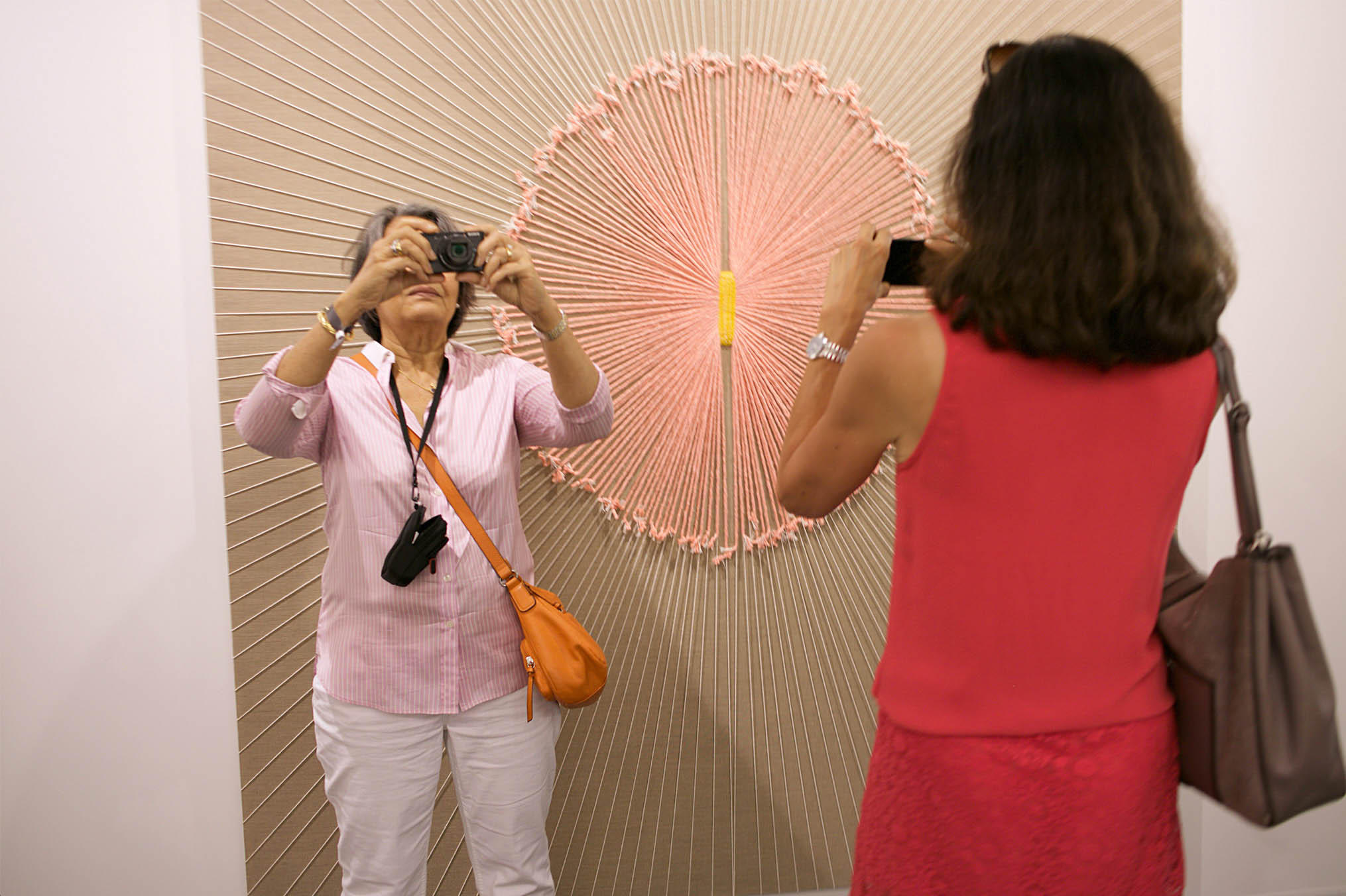 Visitors admiring contemporary works at the Art Basel 2017