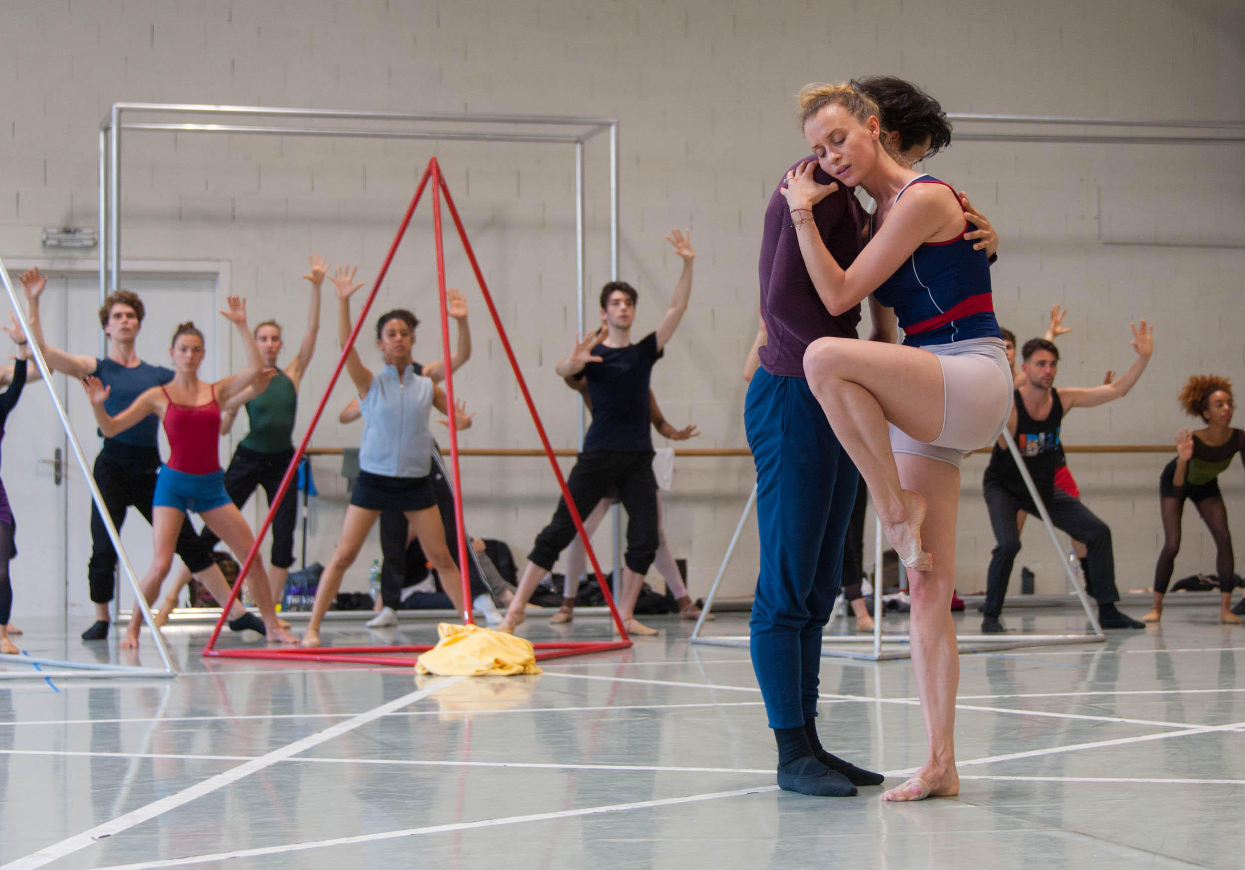 male and female dancer holding one another