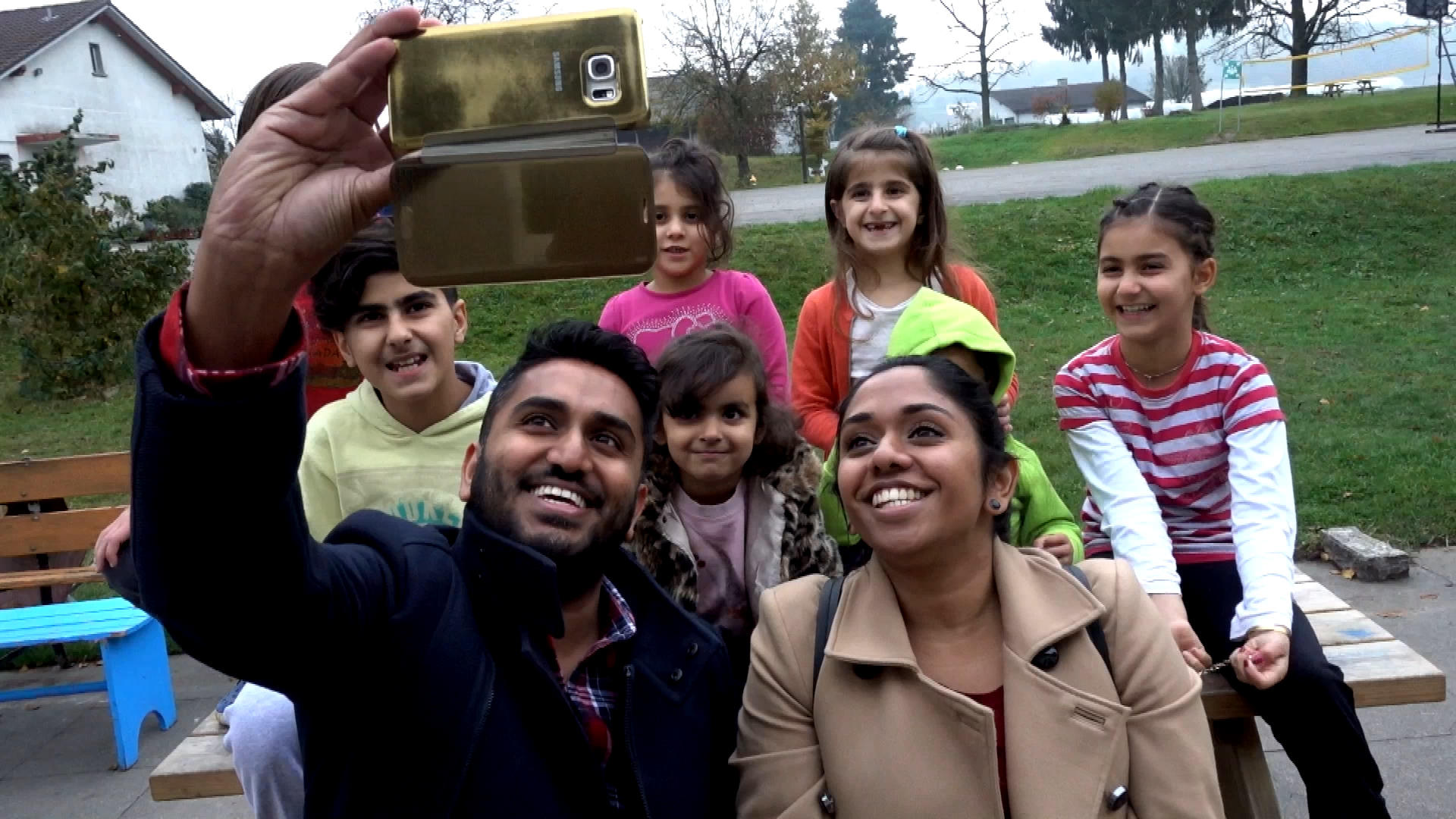 Tama, her brother, and the child asylum seekers at a refugee centre take a selfie