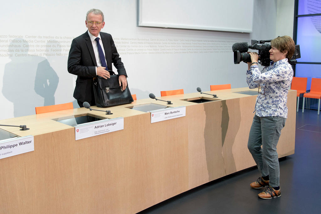 Data protection commissioner Adrian Lobsiger followed by a TV camera