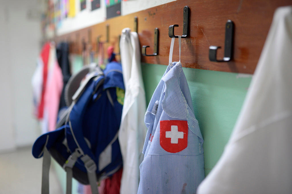 Schoolbag and a shirt of with a Swiss flag in a Swiss school