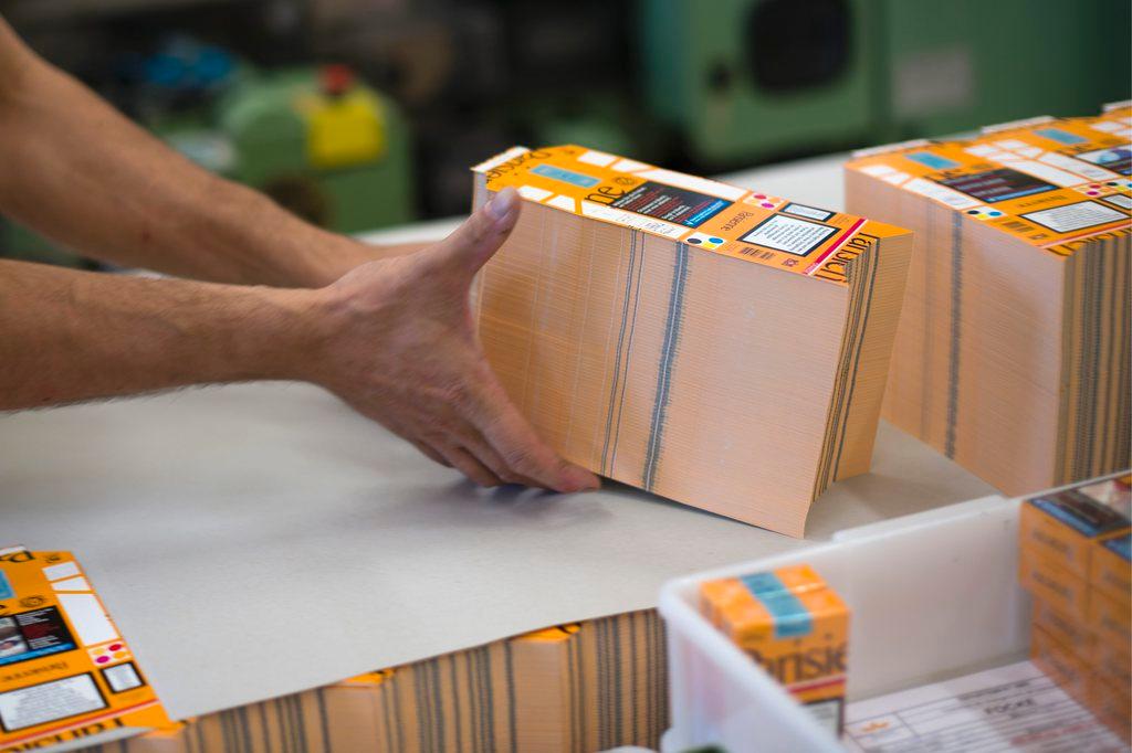 An employee packages cigarettes in Switzerland