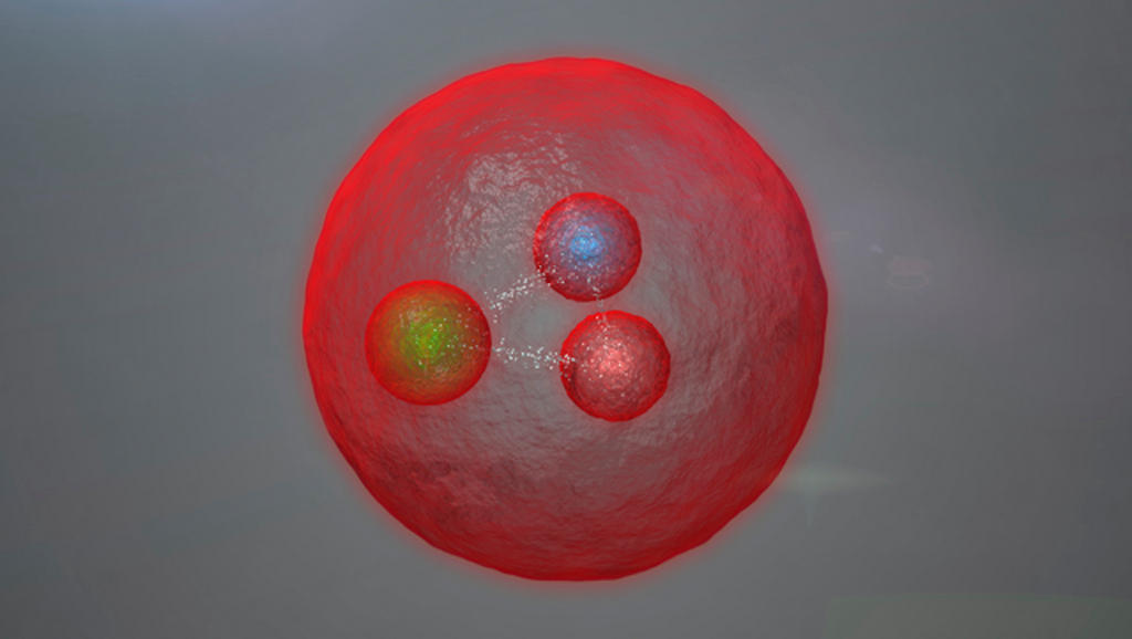 A red sphere that represents an artist s conception of the new subatomic particle found at CERN