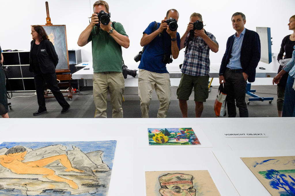 Photographers take pictures of artwork from the Gurlitt collection in Bern