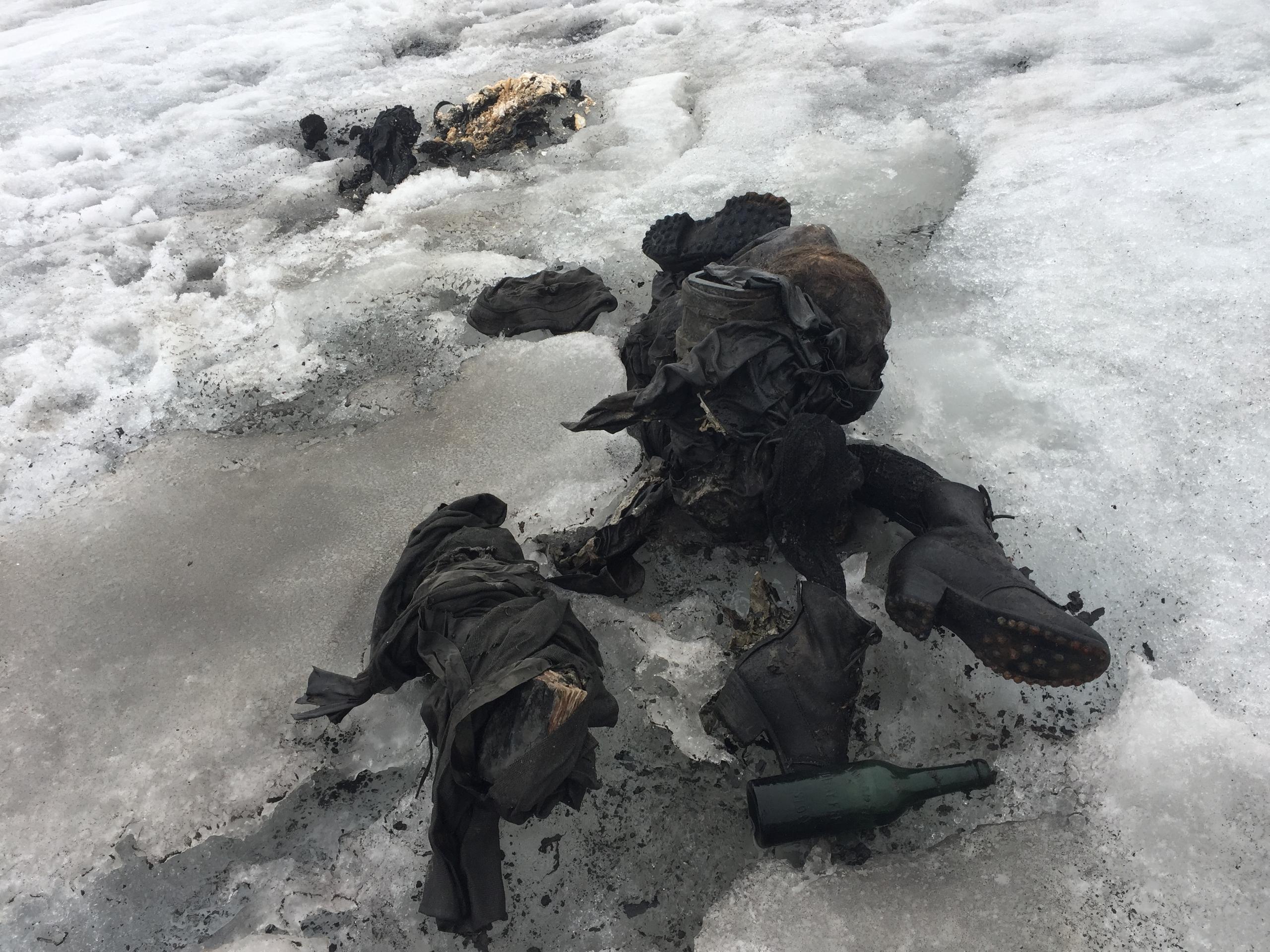 Corpse with boots and a bottle