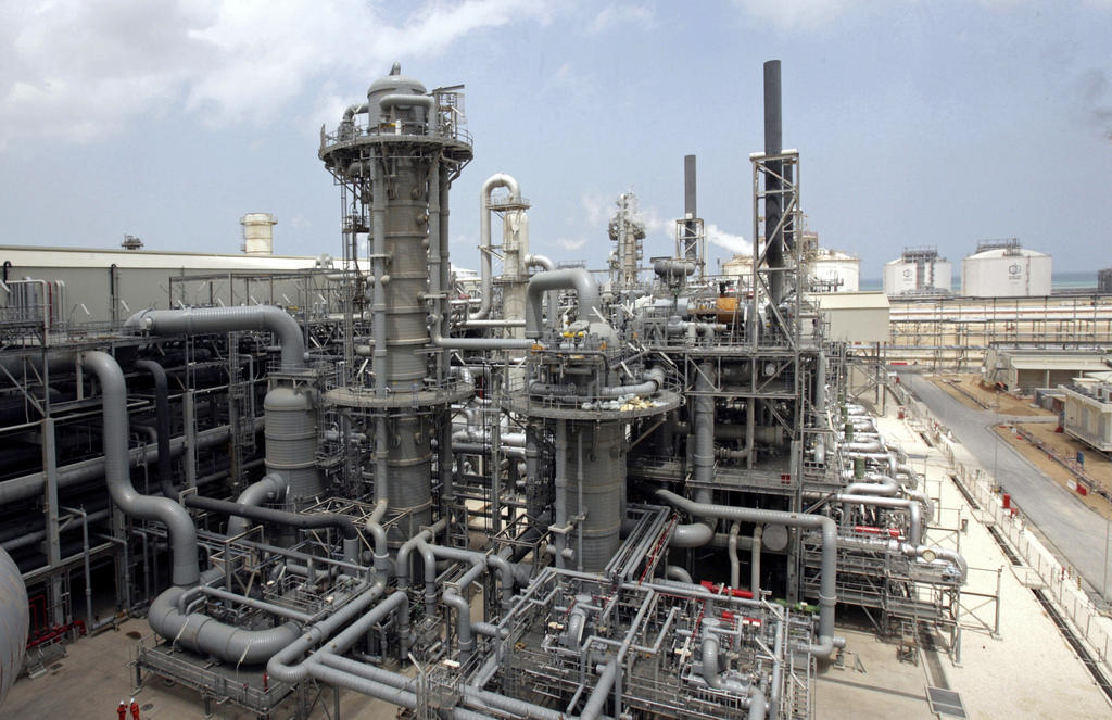 A tangle of steel pipes and towers at a Qatari liquid gas plant