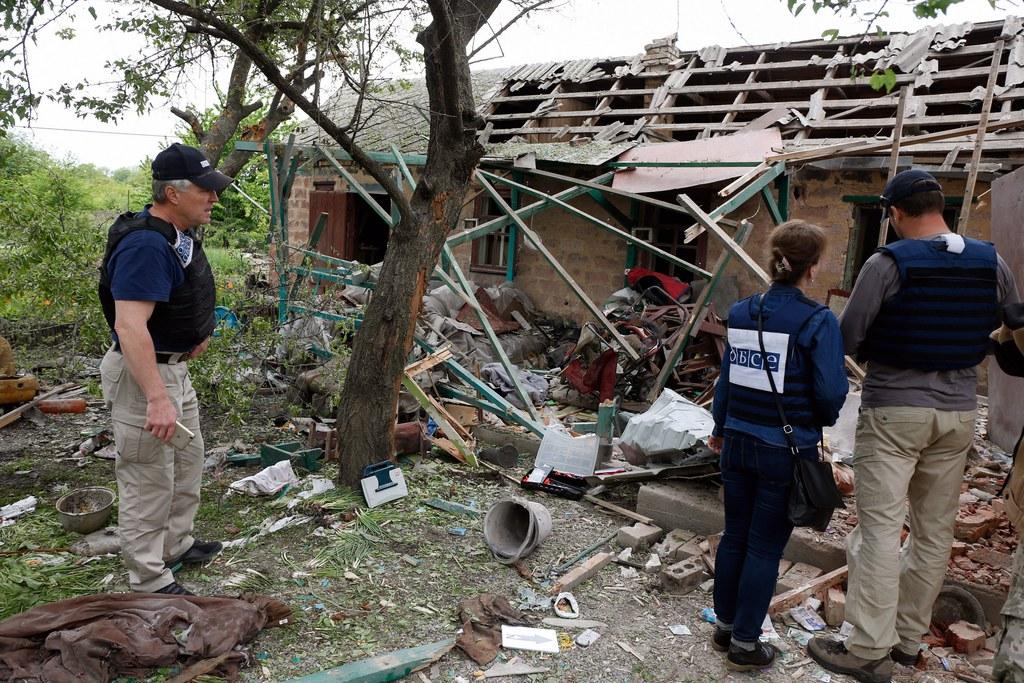 Observers of the Organization for Security and Co-operation in Europe (OSCE) inspect a private building in Ukraine.