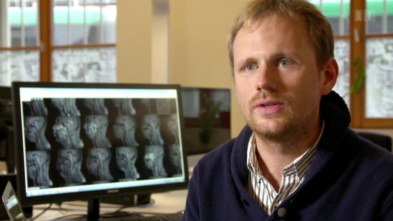 A portrait photo of Kevin Mader before a computer screen