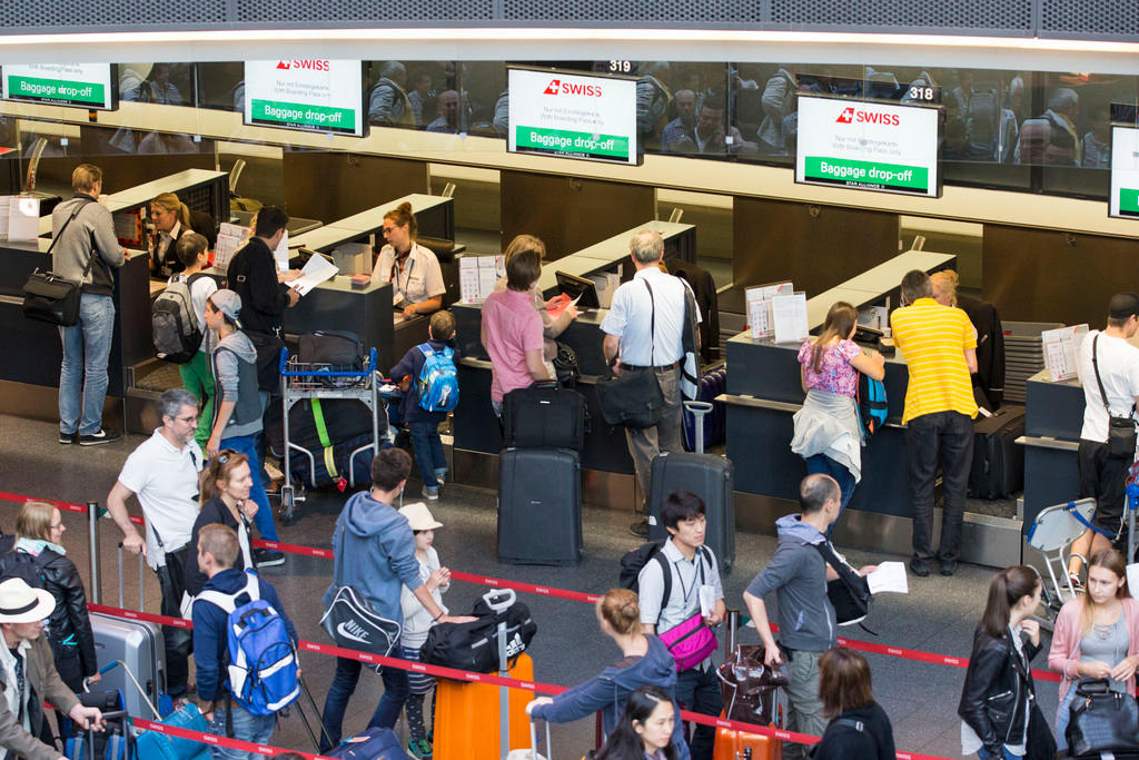 Passenger wait in queue for check in at Zurich airport