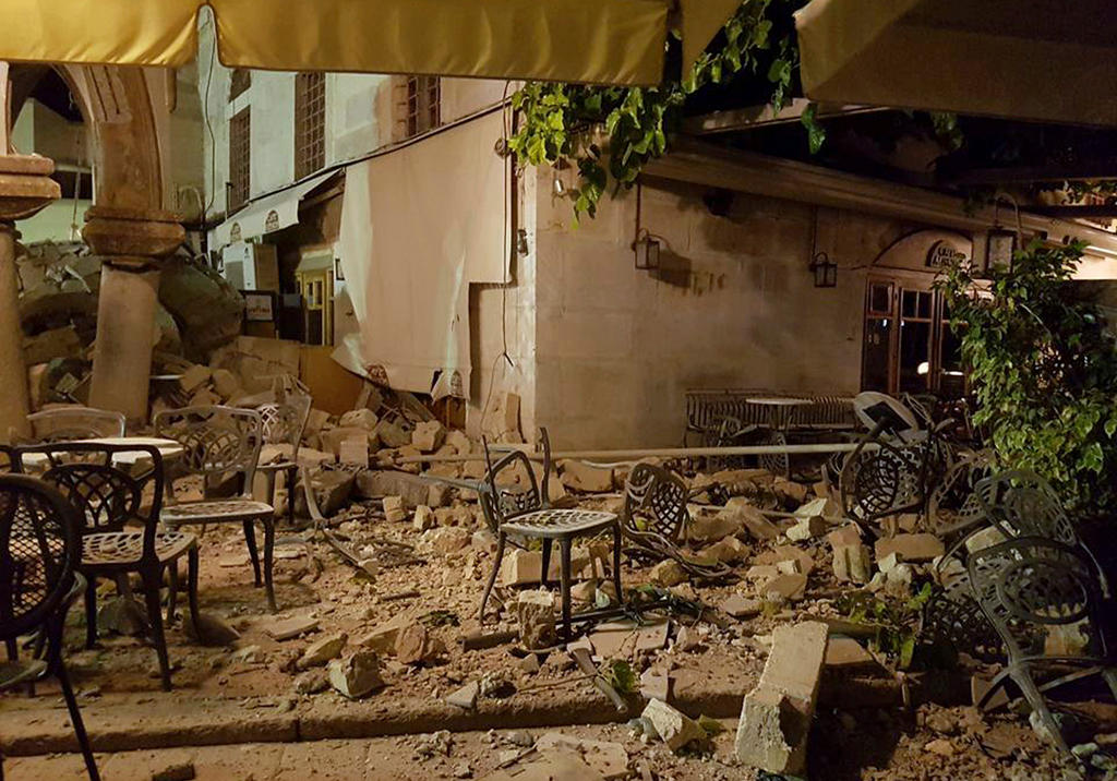 A cafe setting is littered with rubble following a strong earthquake on the Greek island of Kos