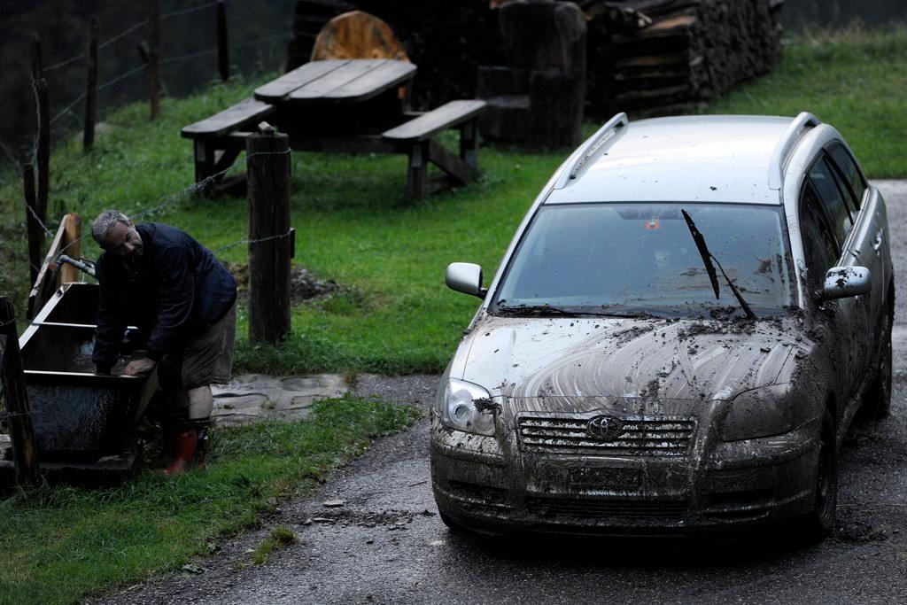 A mud-damaged car
