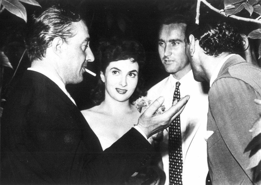 Gina Lollobrigida (centre) with Italian director Vittorio De Sicca (left)