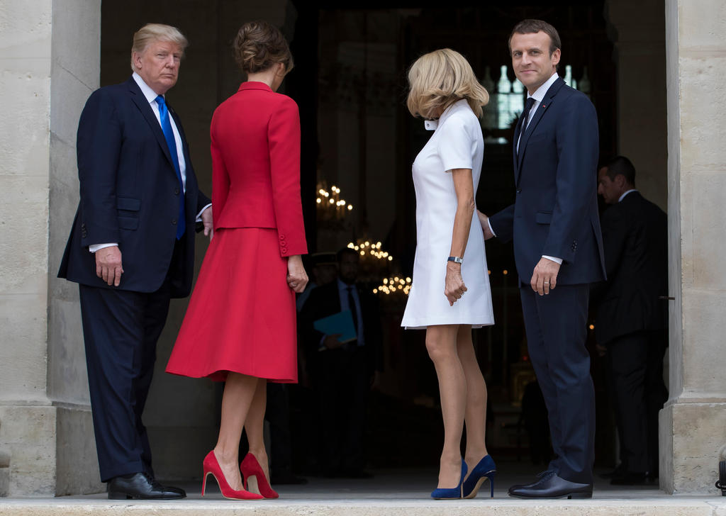 Donald Trump, his wife Melania, Brigitte Macron and French President Emmanuel Macron enter Les Invalides museum in Paris