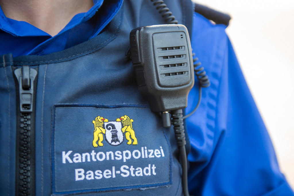 Member of Basel City cantonal police with a radiotelephone