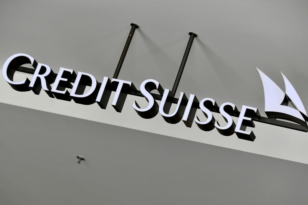 A Credit Suisse signs hangs outside a bank branch