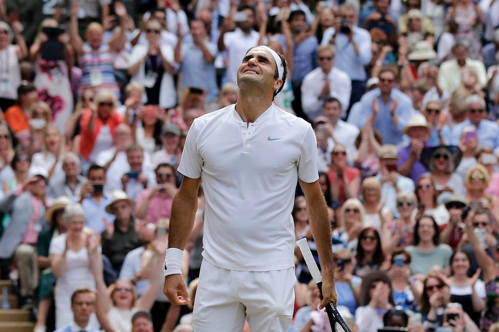 Federer celebrates in front of the Wimbledon crowd