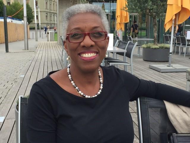 Bernita Bush smiles for the camera at an outdoor restaurant table