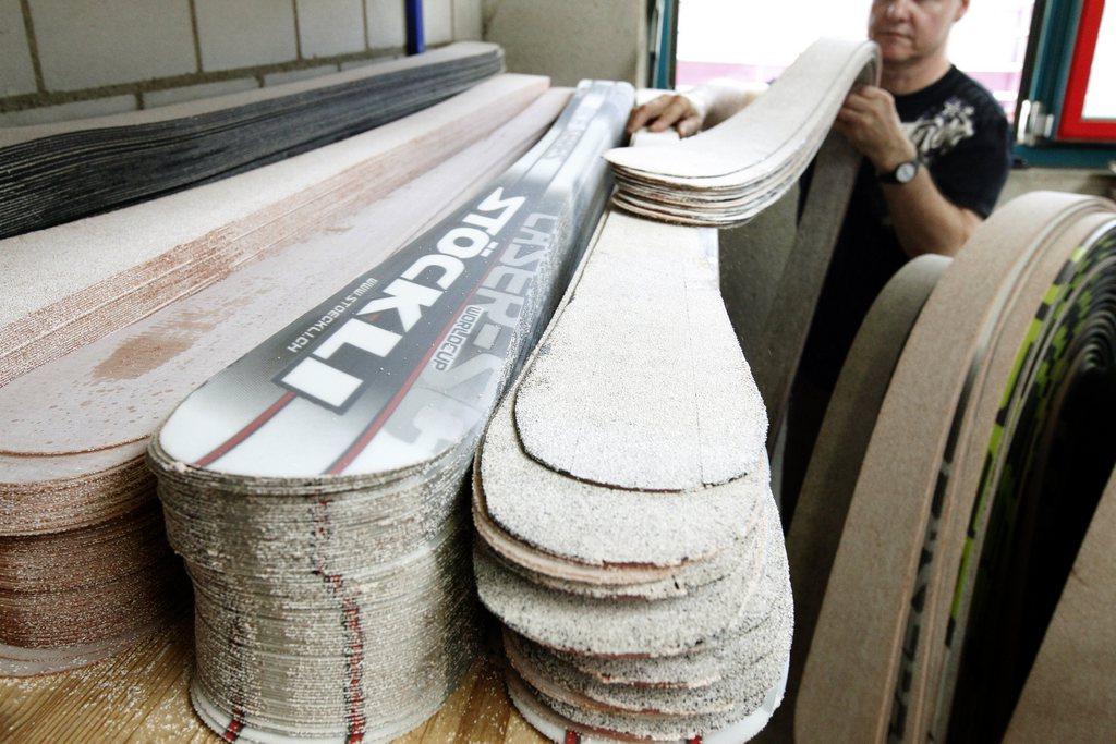 An employee of Swiss ski manufacturer Stoeckli Ski AG at work in Malters, Lucerne.