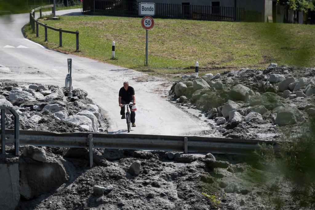 A man rides his bike in Bondo, Graubuenden, on Friday, August 25, 2017