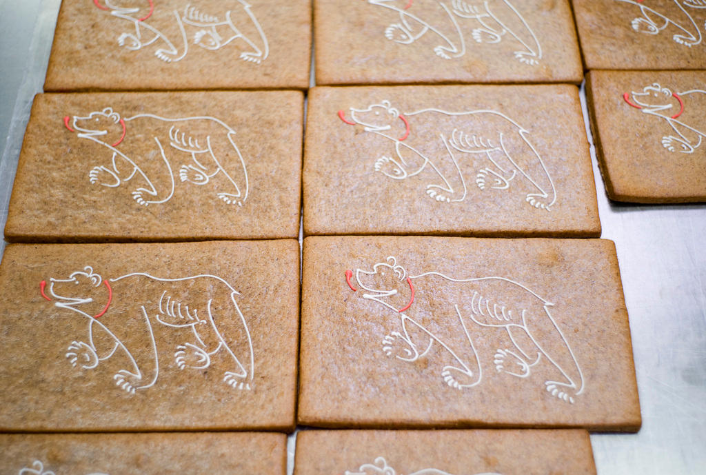 Gingerbread cakes with the motifs of frosted bears, which are put on by hand, in the bakery of a tea room in Bern, Switzerland.
