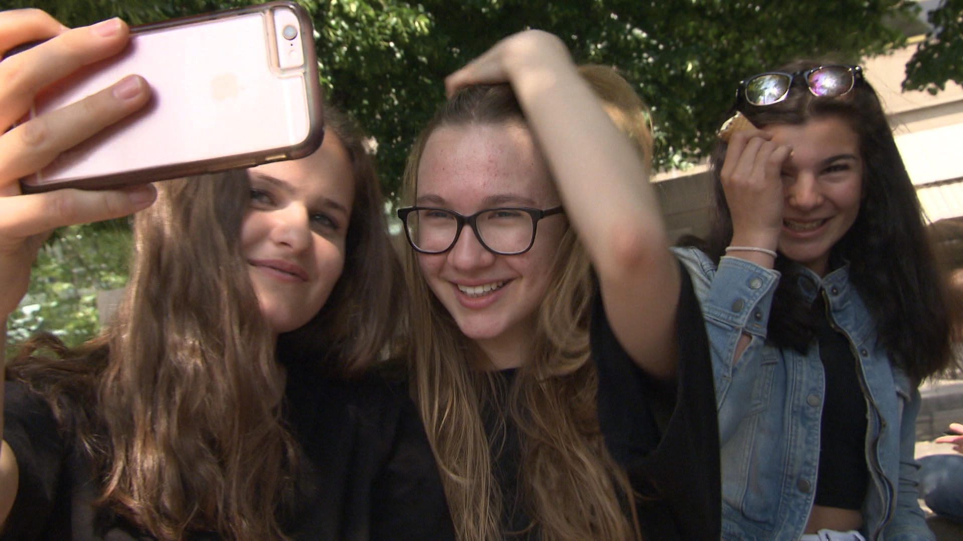 Three girls taking a selfie.