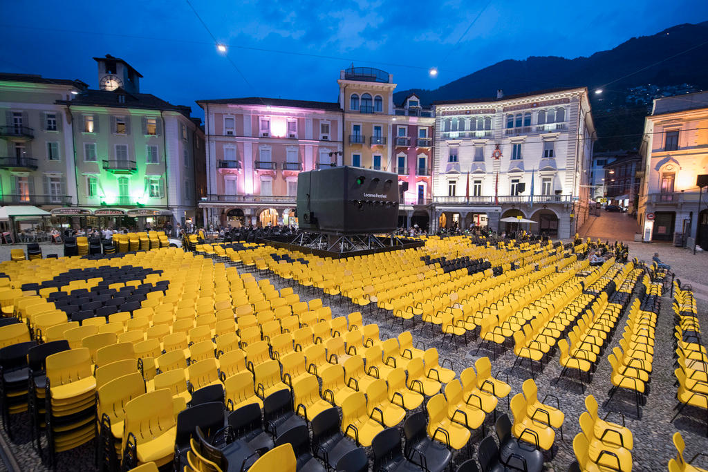 View at dusk of the Piazza Grande with hundreds of yellow and black chairs at the 70th Locarno International Film Festival