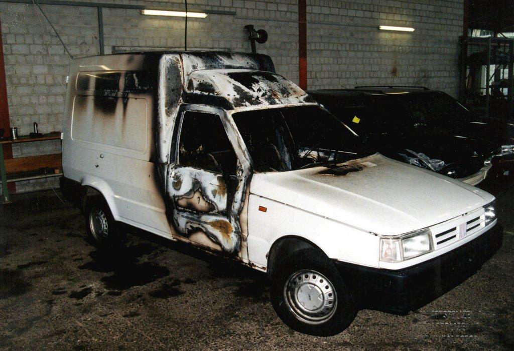 The partially burned getaway car
