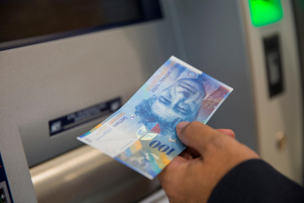 somebody takes 100 CHF from an ATM