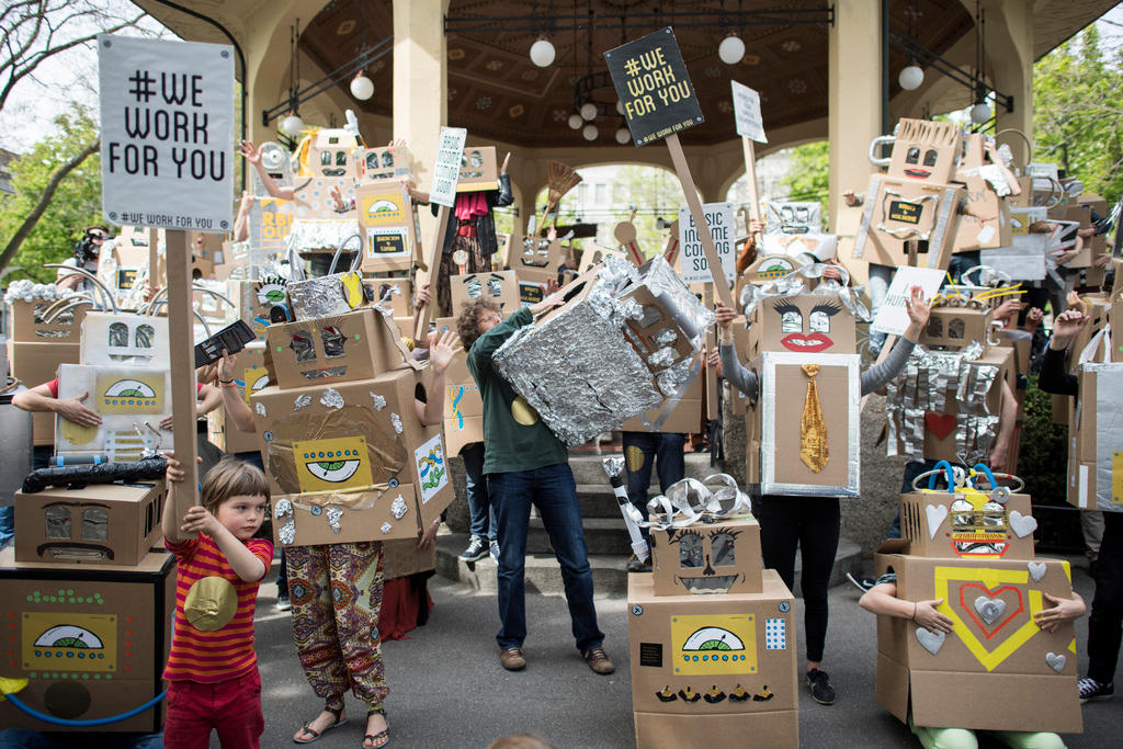 children and adults demonstrate together