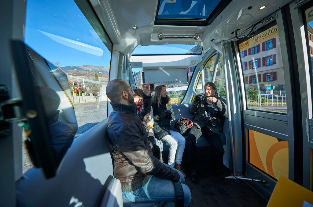 Passengers in driverless bus in Sion