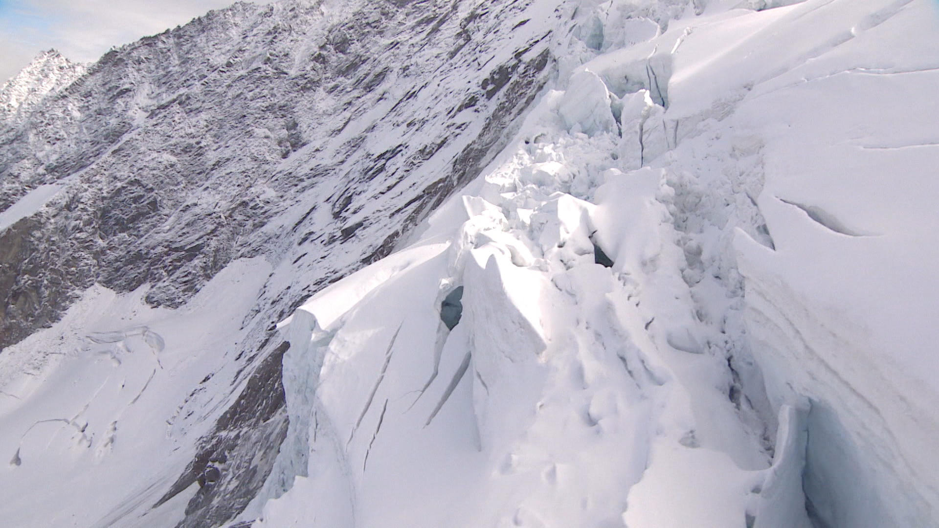 overhead shot of glacier with a part broken off