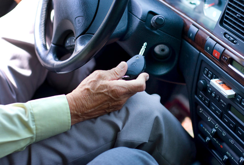 elderly person in a car