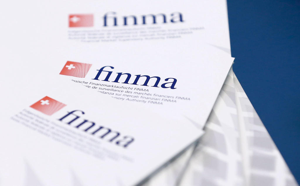 Paper on a table bears the Finma logo