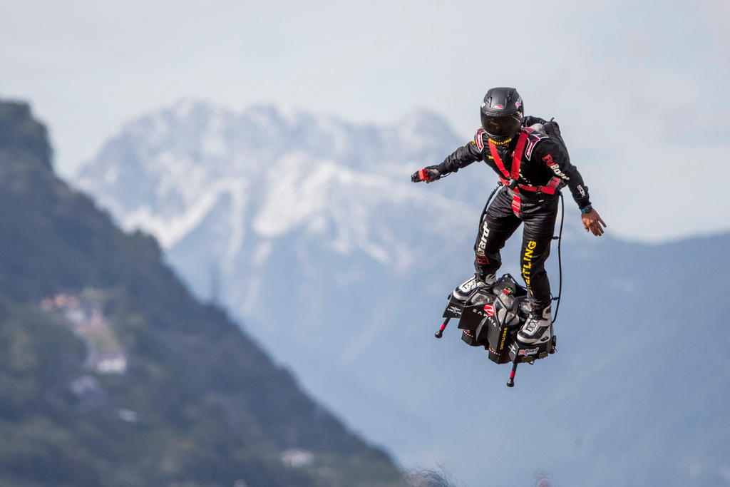 A competitor in a Flyboard contest competes at the International Breitling Sion Airshow in Sion.