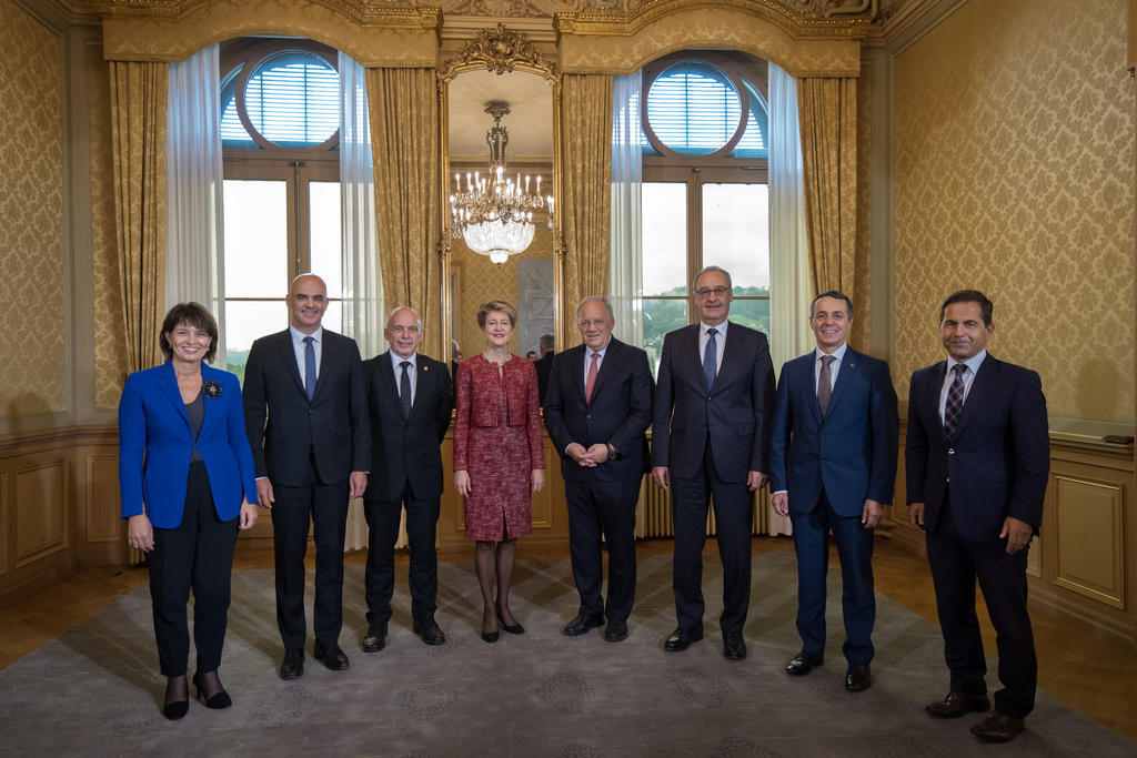 The seven Swiss cabinet minsters and the Federal Chancellor (right)